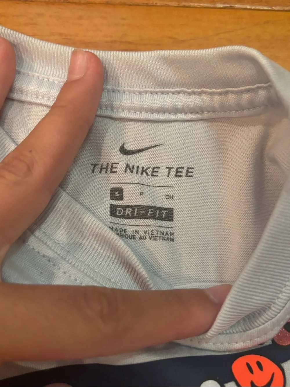 Nike White Tank Top with Navy Floral Swoosh and 'ATHLETE' Text